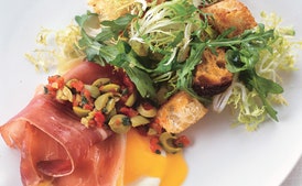 Eggs with Serrano Ham and Manchego Cheese, Green Olive Relish, and Migas
